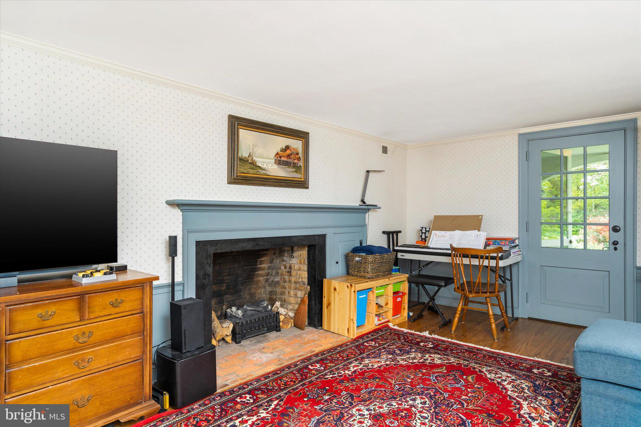 21 Elm Road Princeton, NJ 08540 - Photo 5 of 28 a work room with furniture and a fireplace