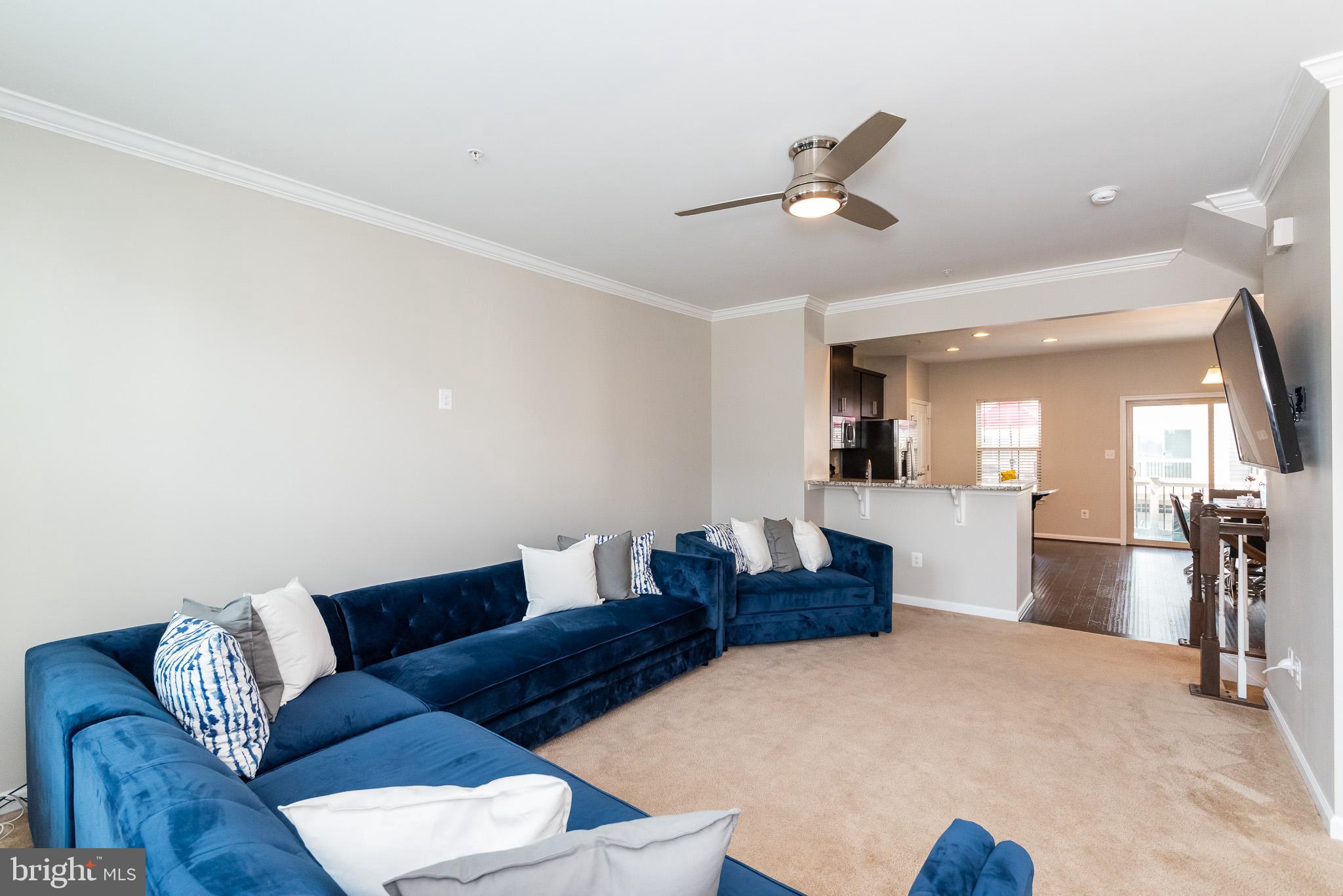 1038 Ramble Run Road Baltimore, MD 21220 - Photo 11 of 47 a living room with furniture and a wooden floor