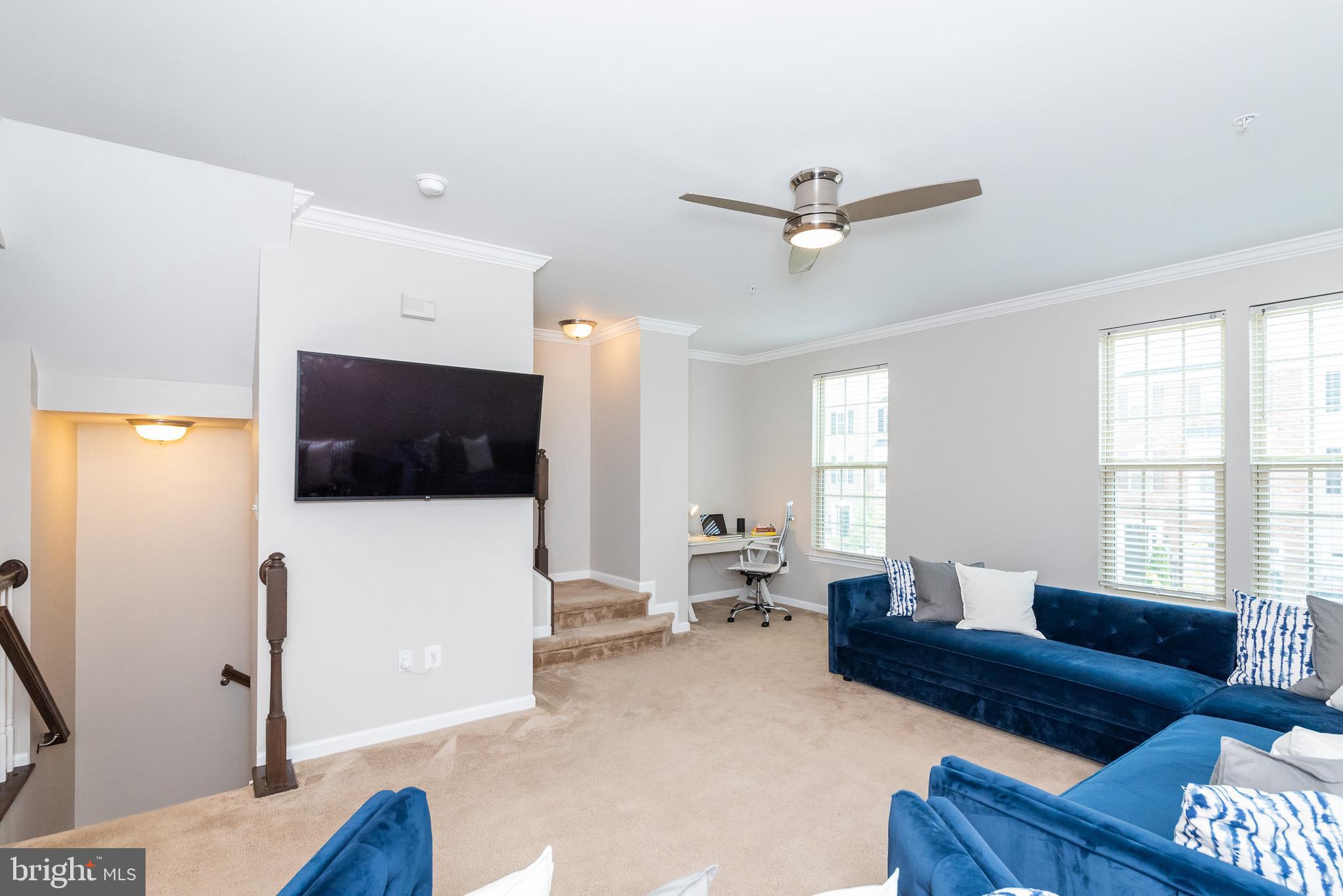 1038 Ramble Run Road Baltimore, MD 21220 - Photo 13 of 47 a living room with furniture and a flat screen tv