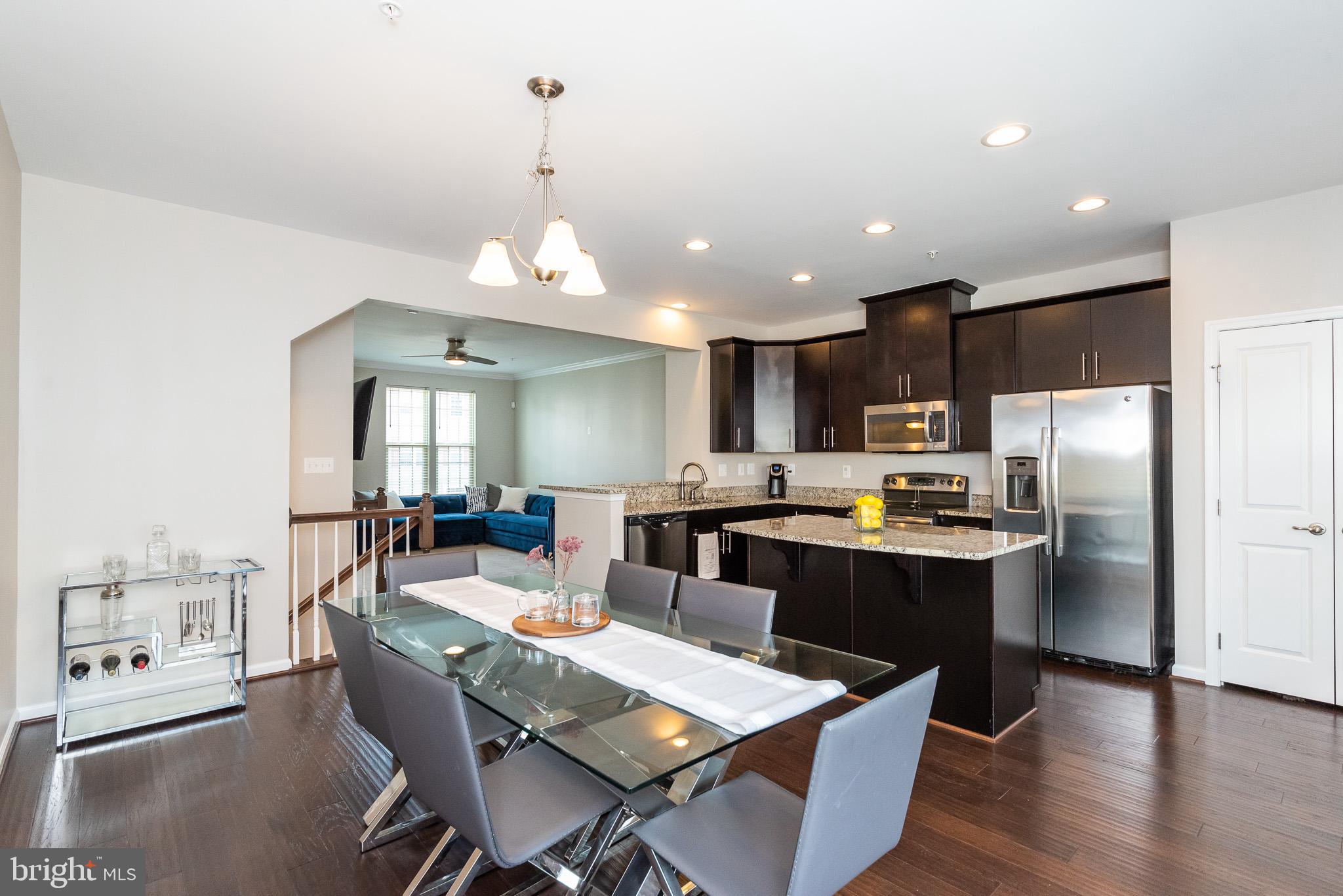 1038 Ramble Run Road Baltimore, MD 21220 - Photo 17 of 47 a large kitchen with a table and chairs