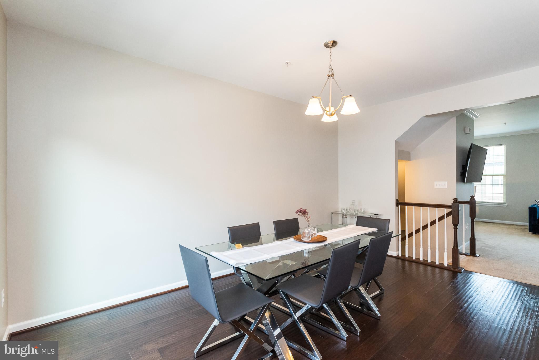 1038 Ramble Run Road Baltimore, MD 21220 - Photo 18 of 47 a view of a dining room with furniture and wooden floor