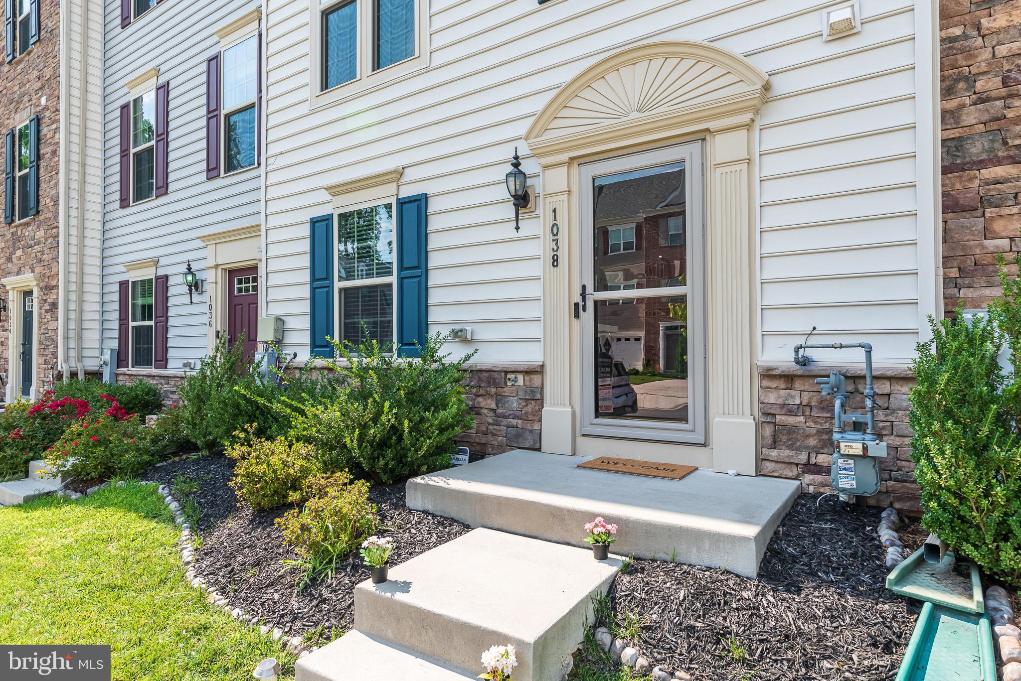 1038 Ramble Run Road Baltimore, MD 21220 - Photo 3 of 47 a front view of a house with a garden