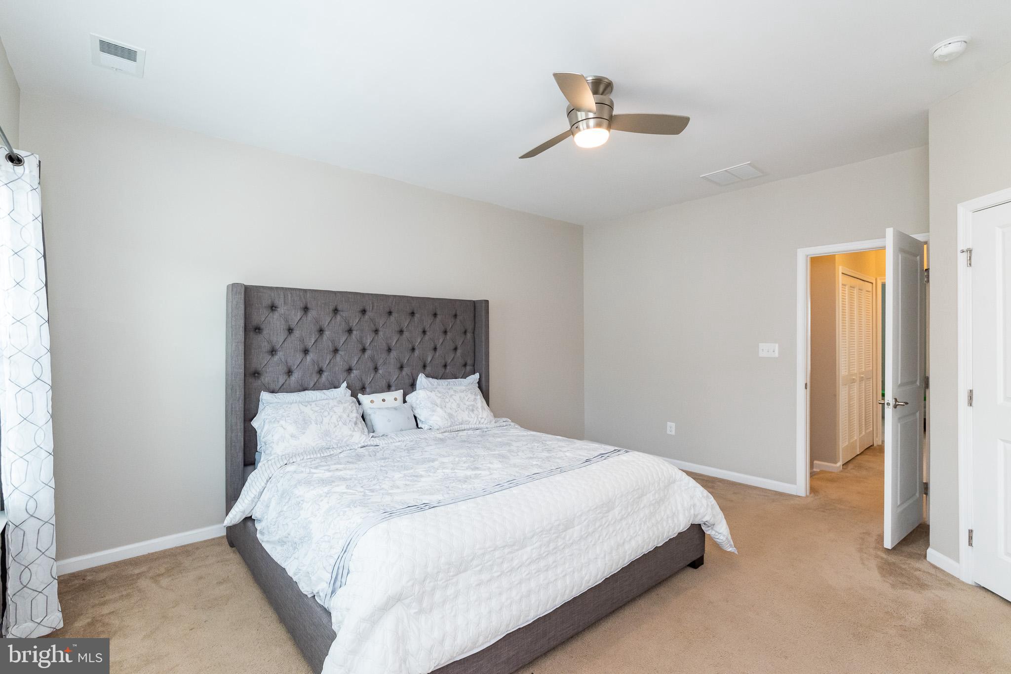 1038 Ramble Run Road Baltimore, MD 21220 - Photo 29 of 47 a bedroom with a bed and a window