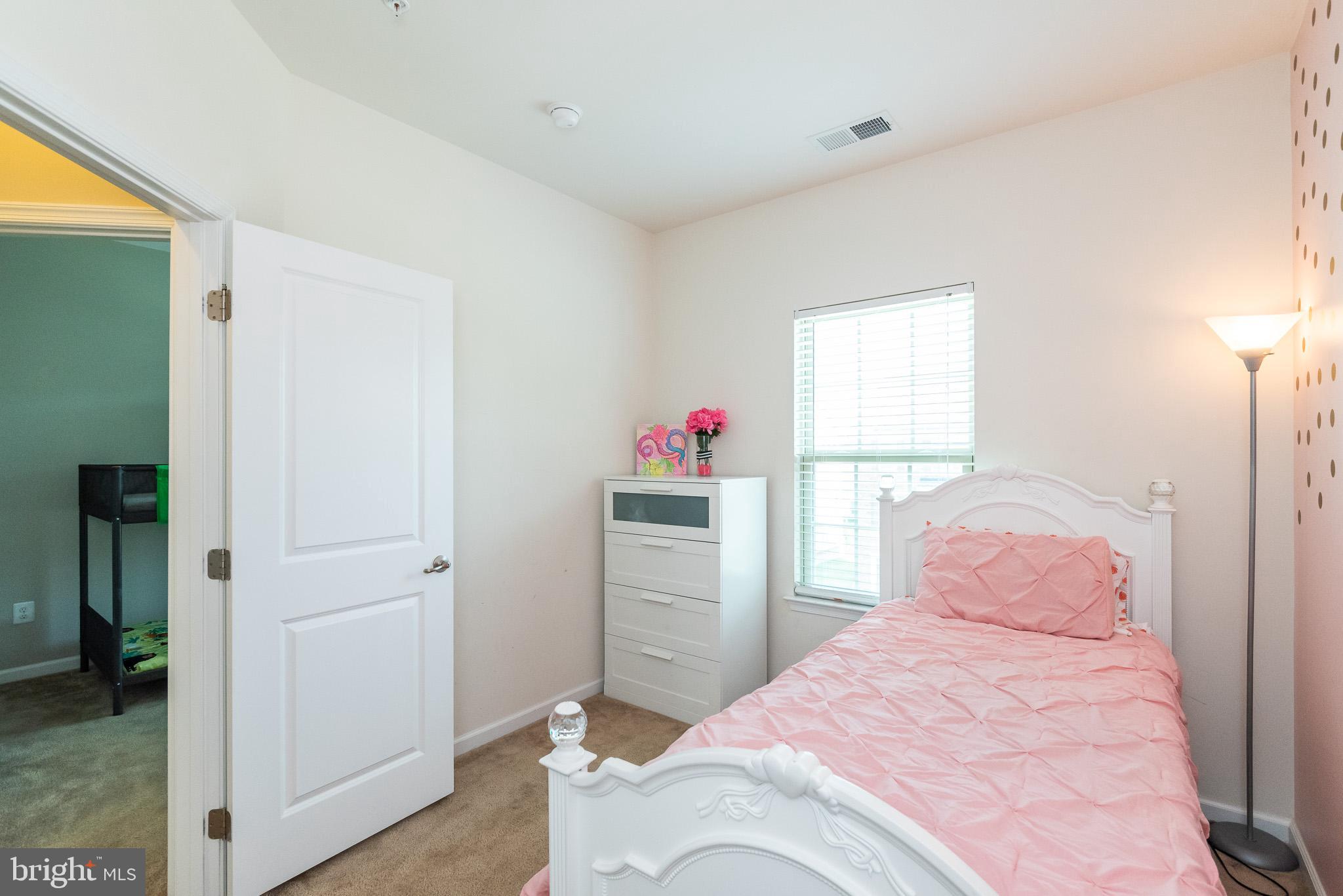 1038 Ramble Run Road Baltimore, MD 21220 - Photo 35 of 47 a bedroom with a bed and a window