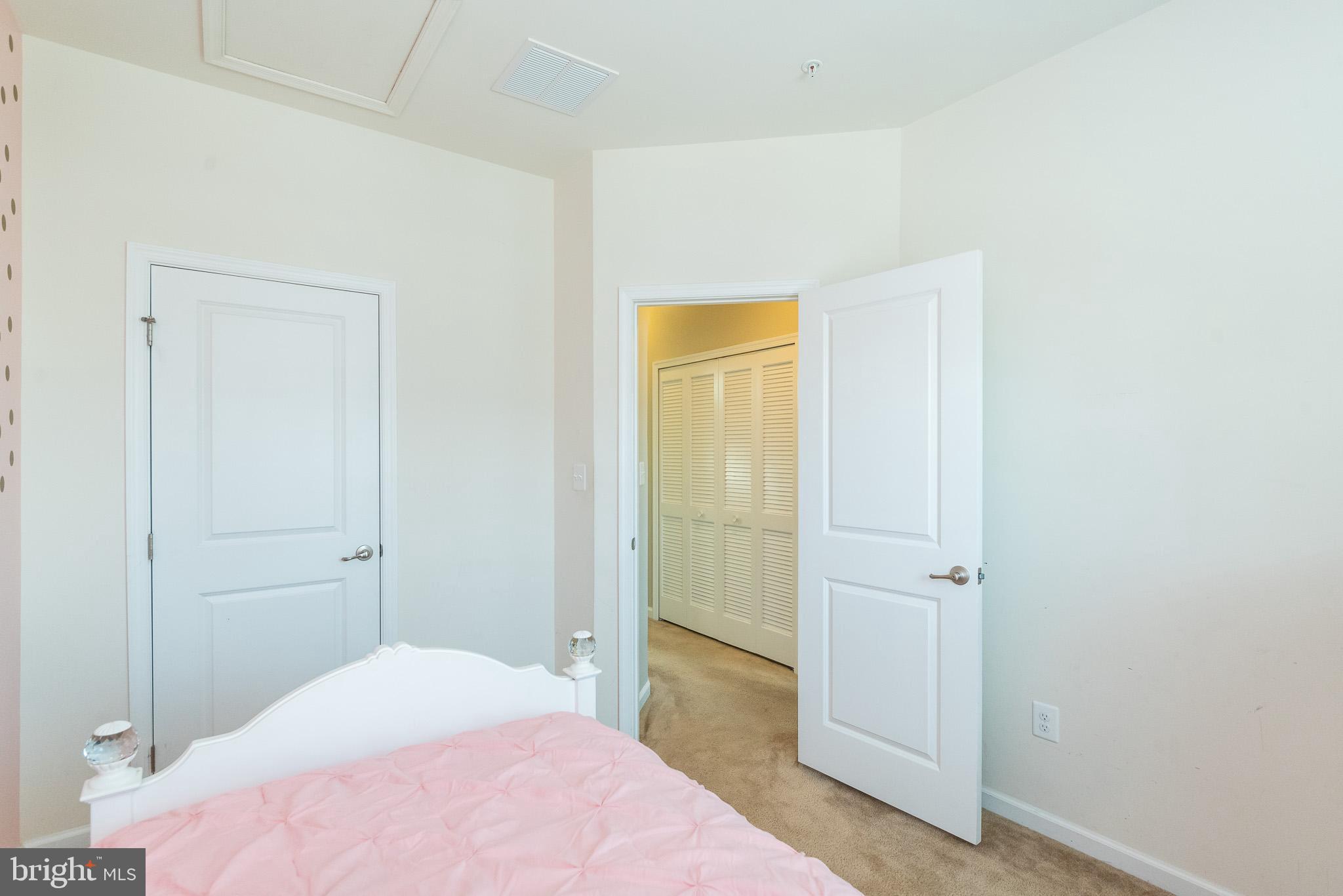 1038 Ramble Run Road Baltimore, MD 21220 - Photo 36 of 47 a bedroom with a bed and hallway