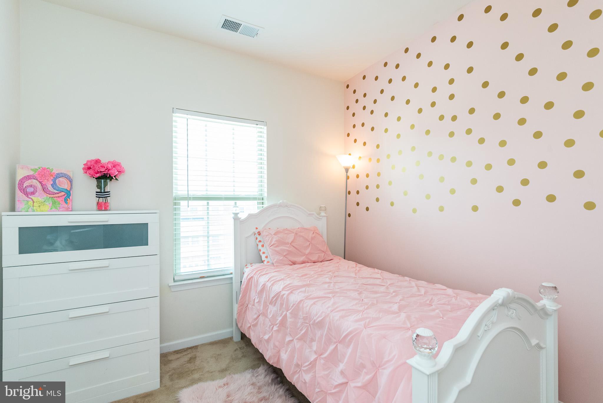 1038 Ramble Run Road Baltimore, MD 21220 - Photo 38 of 47 a bedroom with a bed and a window