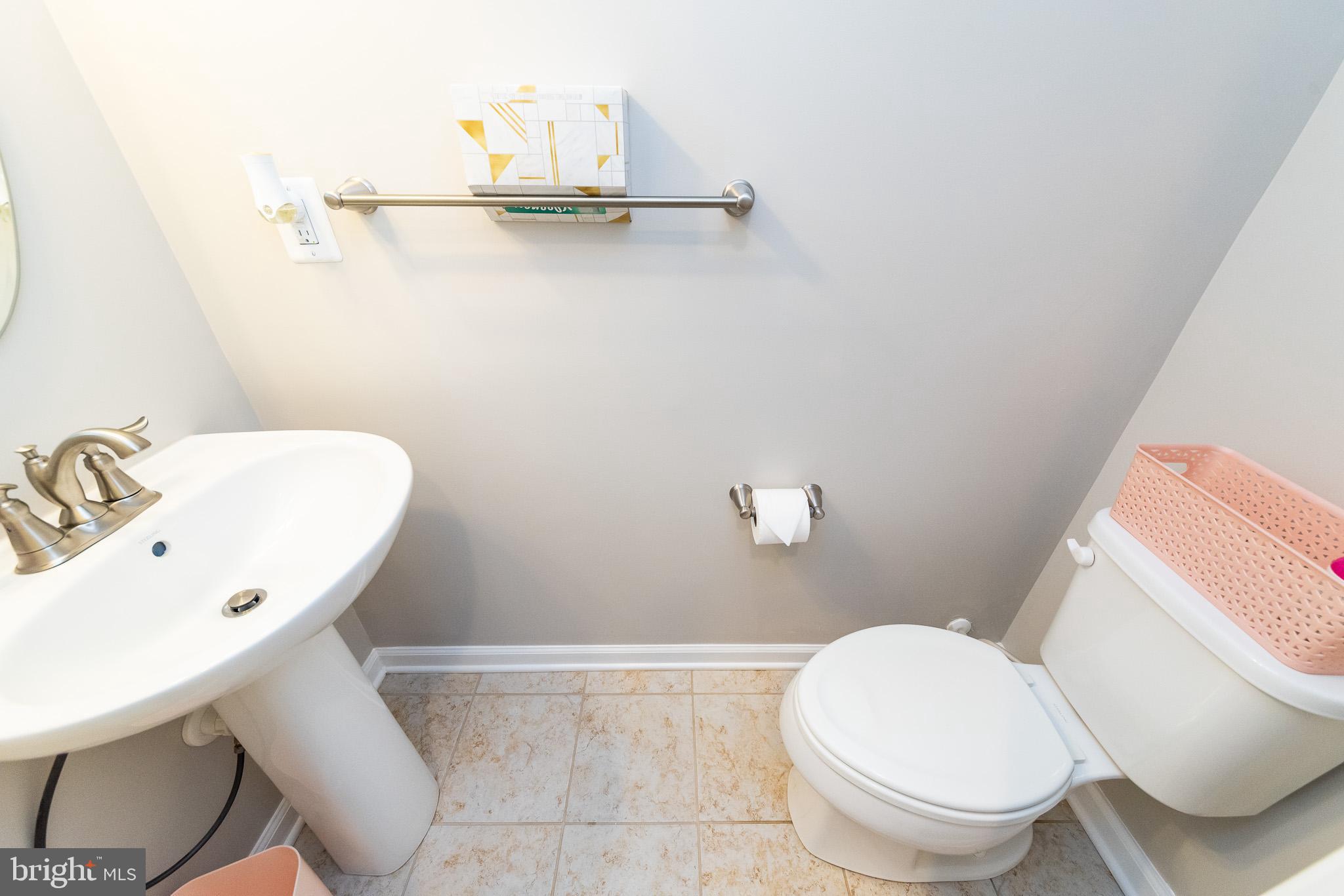 1038 Ramble Run Road Baltimore, MD 21220 - Photo 5 of 47 a bathroom with a sink and a toilet