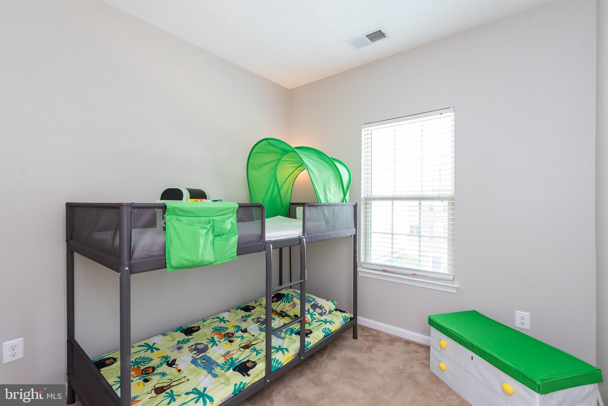 1038 Ramble Run Road Baltimore, MD 21220 - Photo 42 of 47 a bedroom with bed and a window