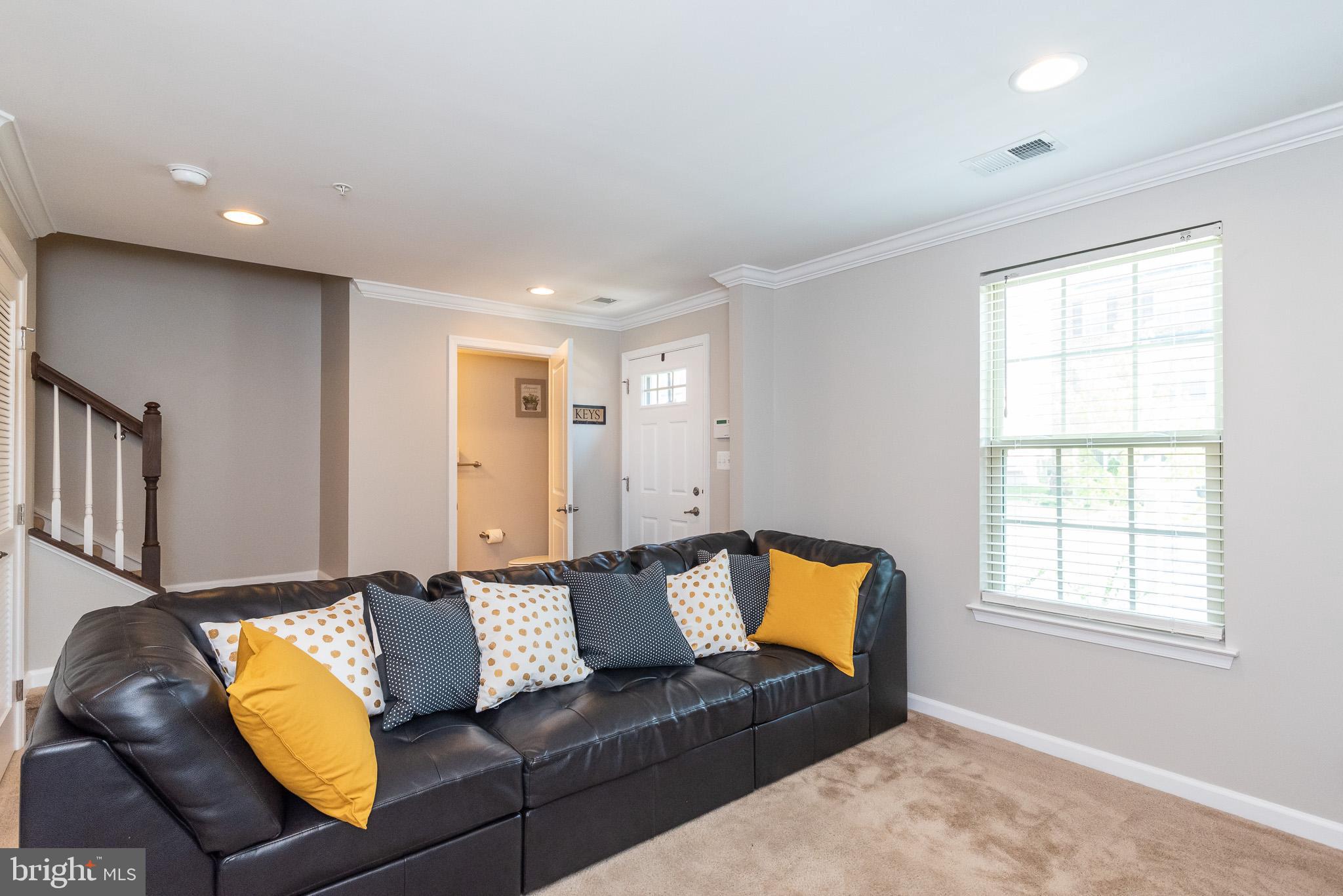 1038 Ramble Run Road Baltimore, MD 21220 - Photo 6 of 47 a living room with furniture and a window