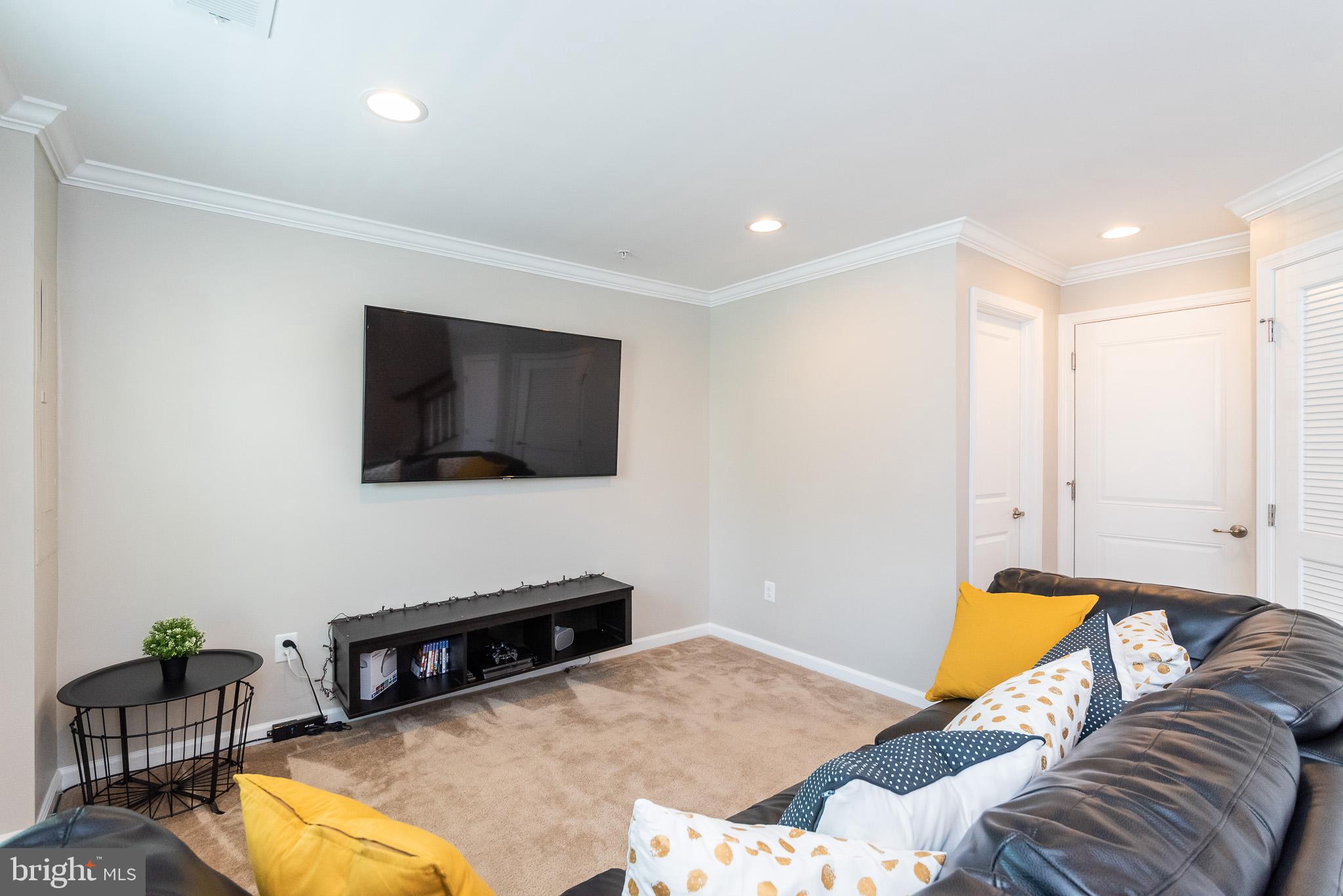 1038 Ramble Run Road Baltimore, MD 21220 - Photo 9 of 47 a bedroom with a bed and flat screen tv