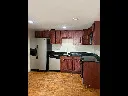 a kitchen with stainless steel appliances granite countertop a refrigerator and a stove