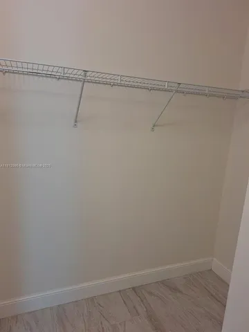 a view of a room with racks on the wall