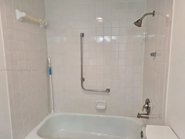 a bathroom with a sink vanity and mirror