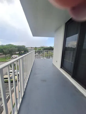 a view of a balcony with stairs