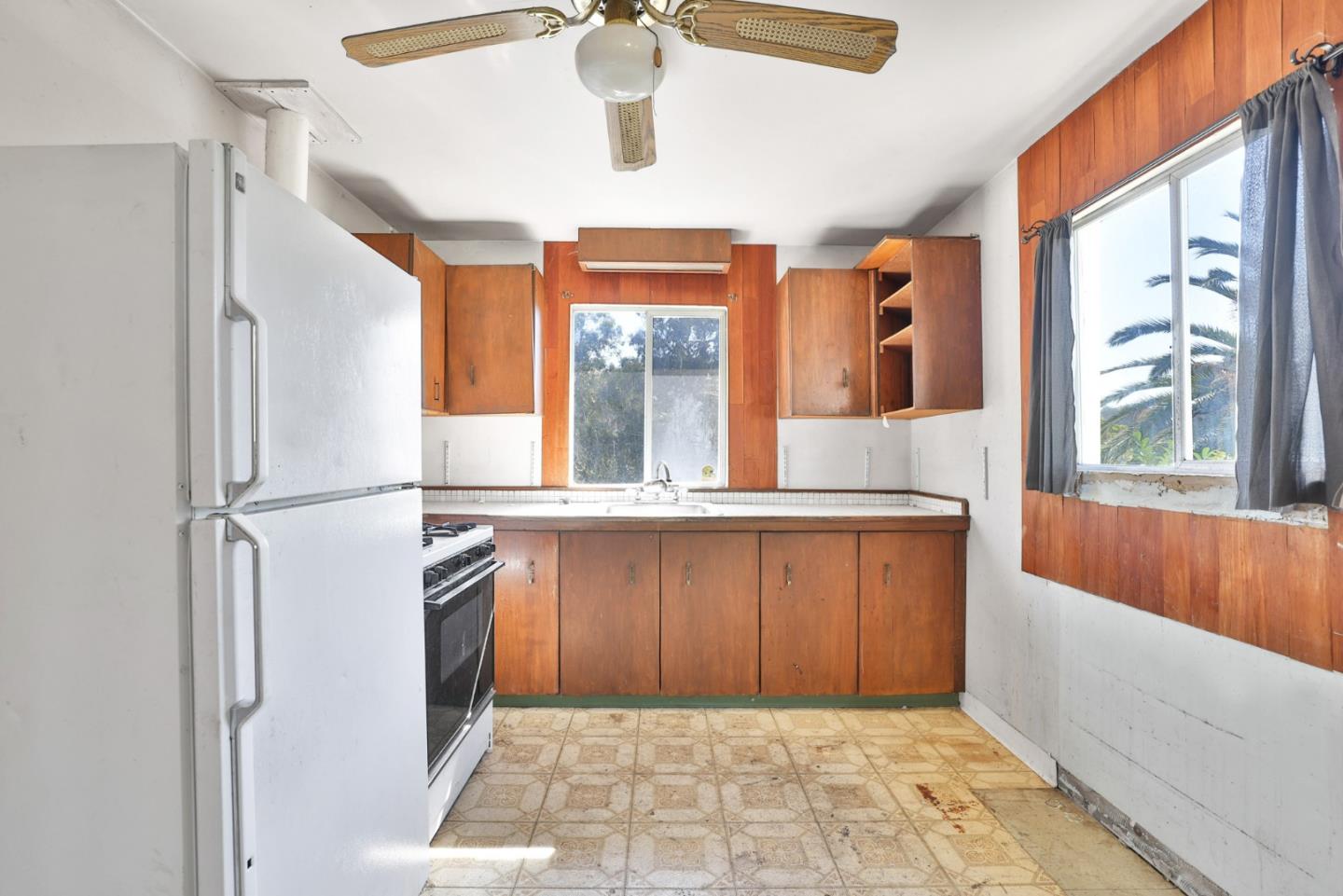 2291 Upland Road San Leandro, CA 94578 - Photo 11 of 32 a bathroom with a granite countertop sink a mirror and a bathtub