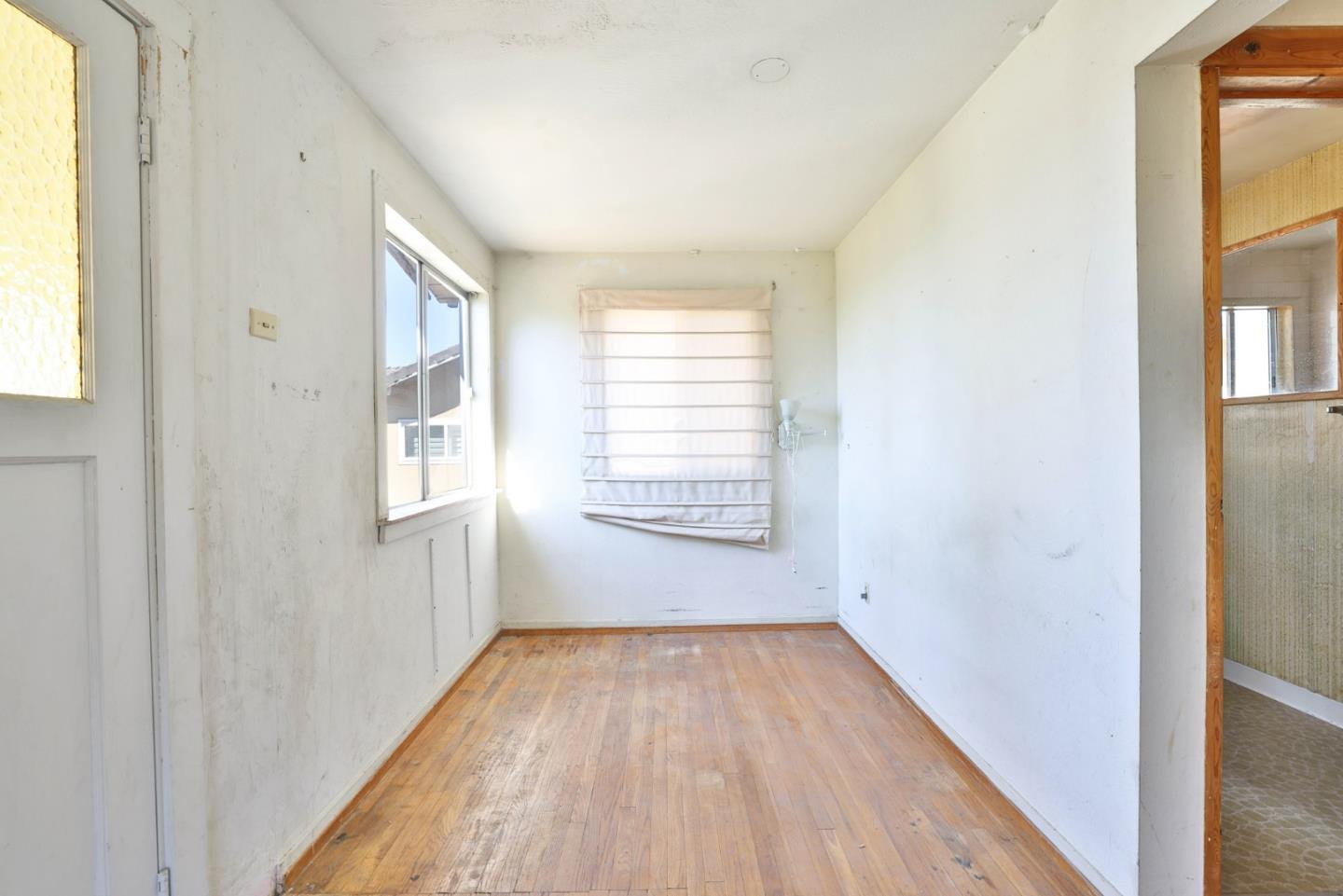 2291 Upland Road San Leandro, CA 94578 - Photo 12 of 32 a view of a room with wooden floor and windows