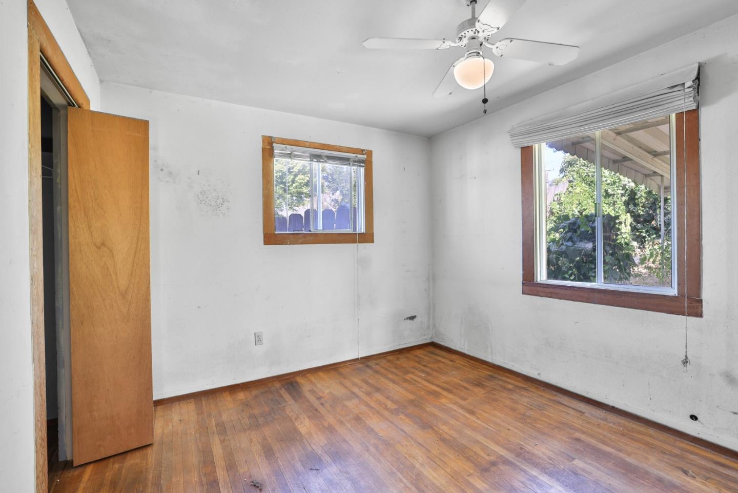 2291 Upland Road San Leandro, CA 94578 - Photo 14 of 32 a view of an empty room with wooden floor and a window