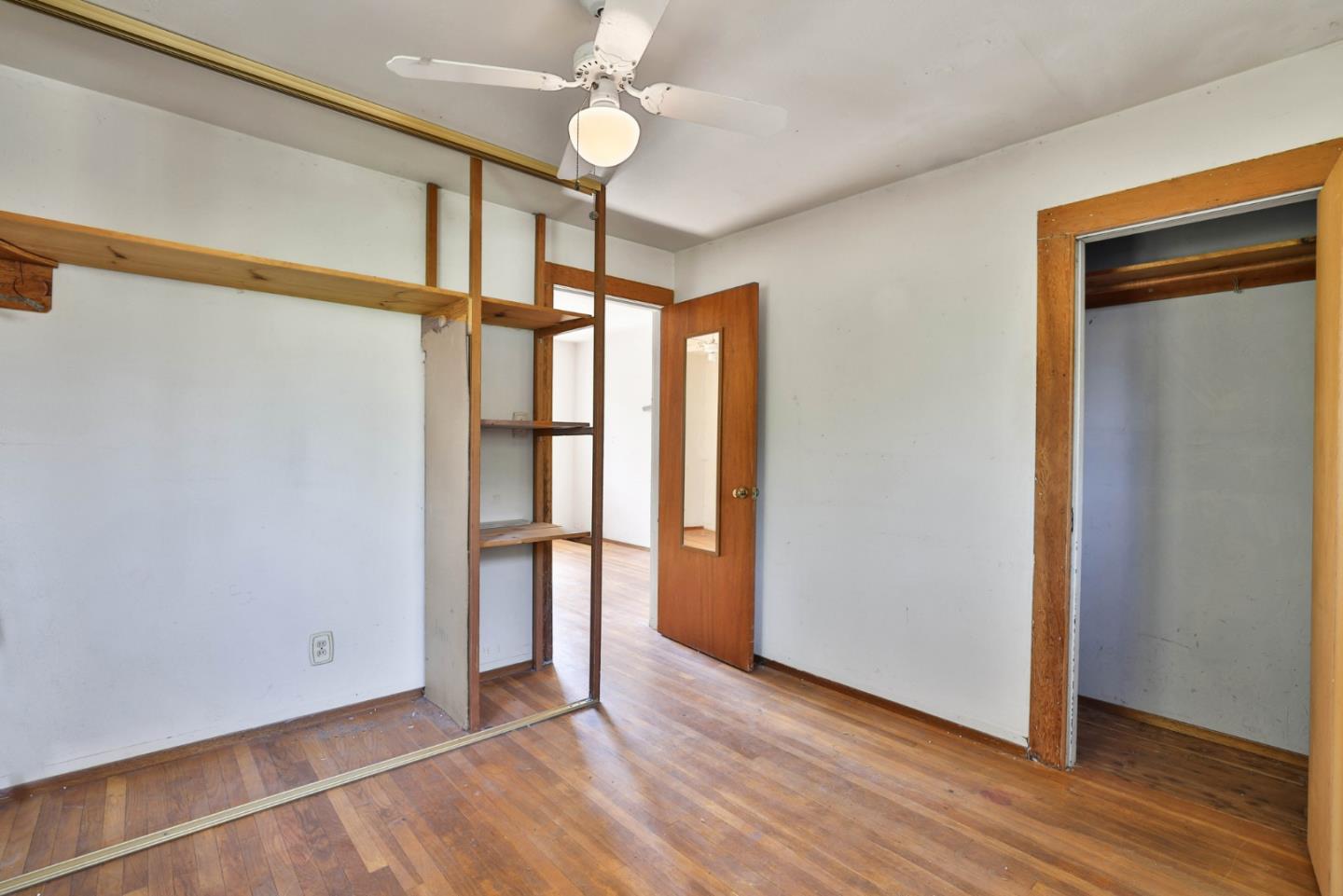 2291 Upland Road San Leandro, CA 94578 - Photo 15 of 32 a view of an empty room with wooden floor and a window