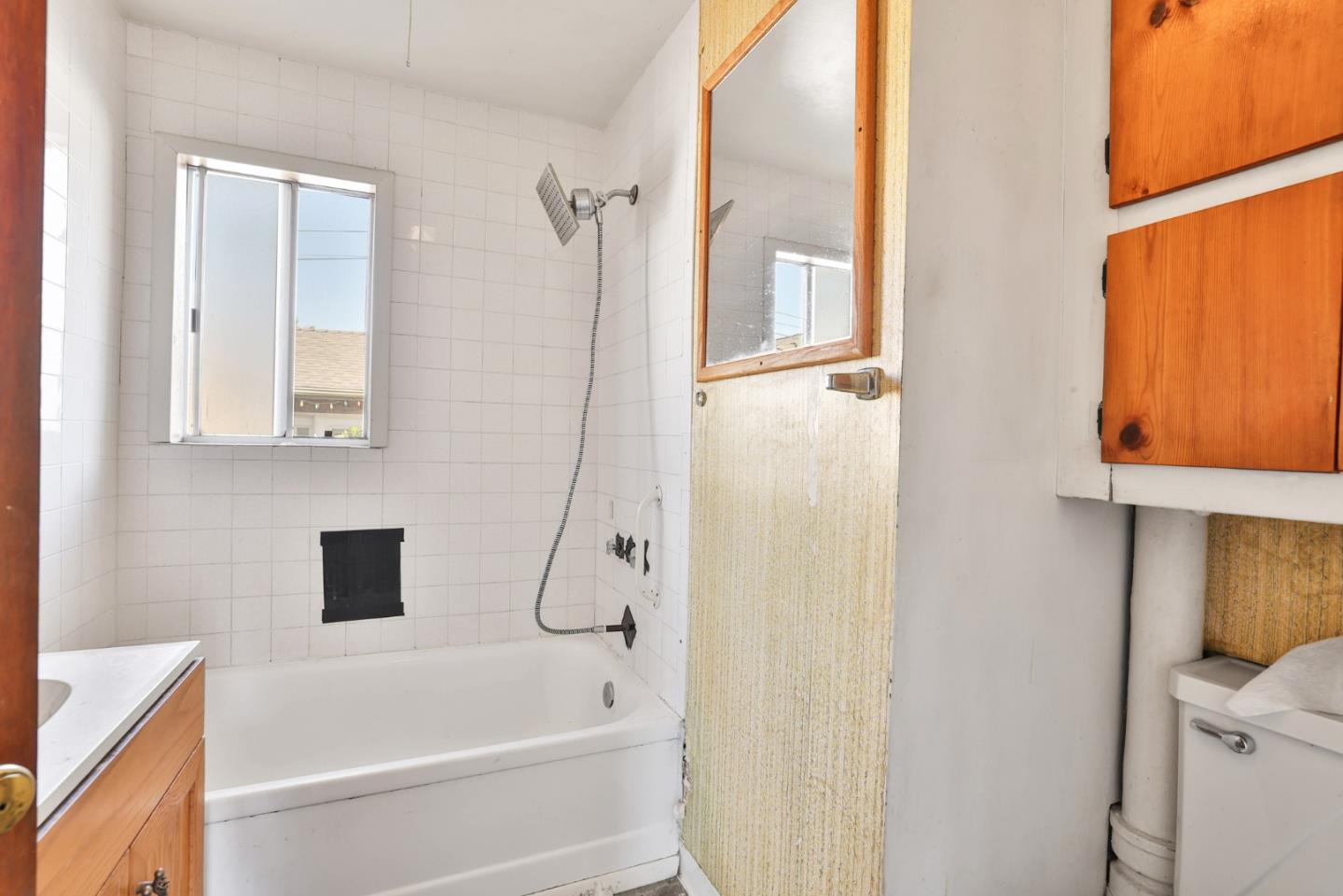 2291 Upland Road San Leandro, CA 94578 - Photo 16 of 32 a bathroom with a bathtub and a shower