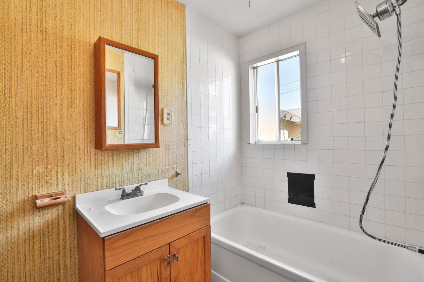 2291 Upland Road San Leandro, CA 94578 - Photo 17 of 32 a bathroom with a sink and a bathtub
