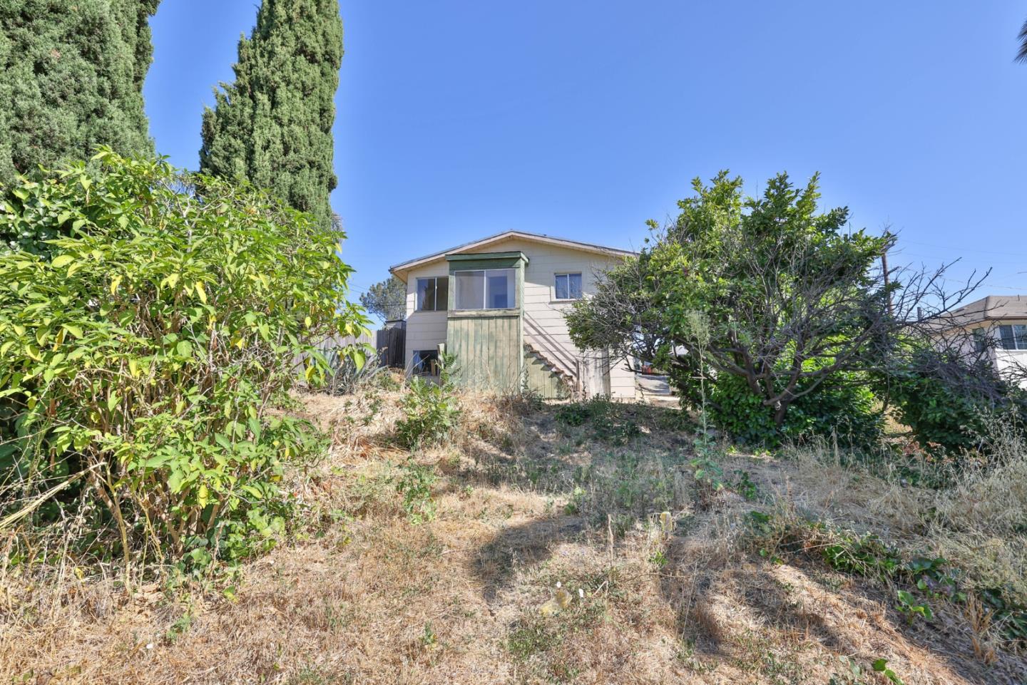 2291 Upland Road San Leandro, CA 94578 - Photo 22 of 32 a front view of a house with a yard