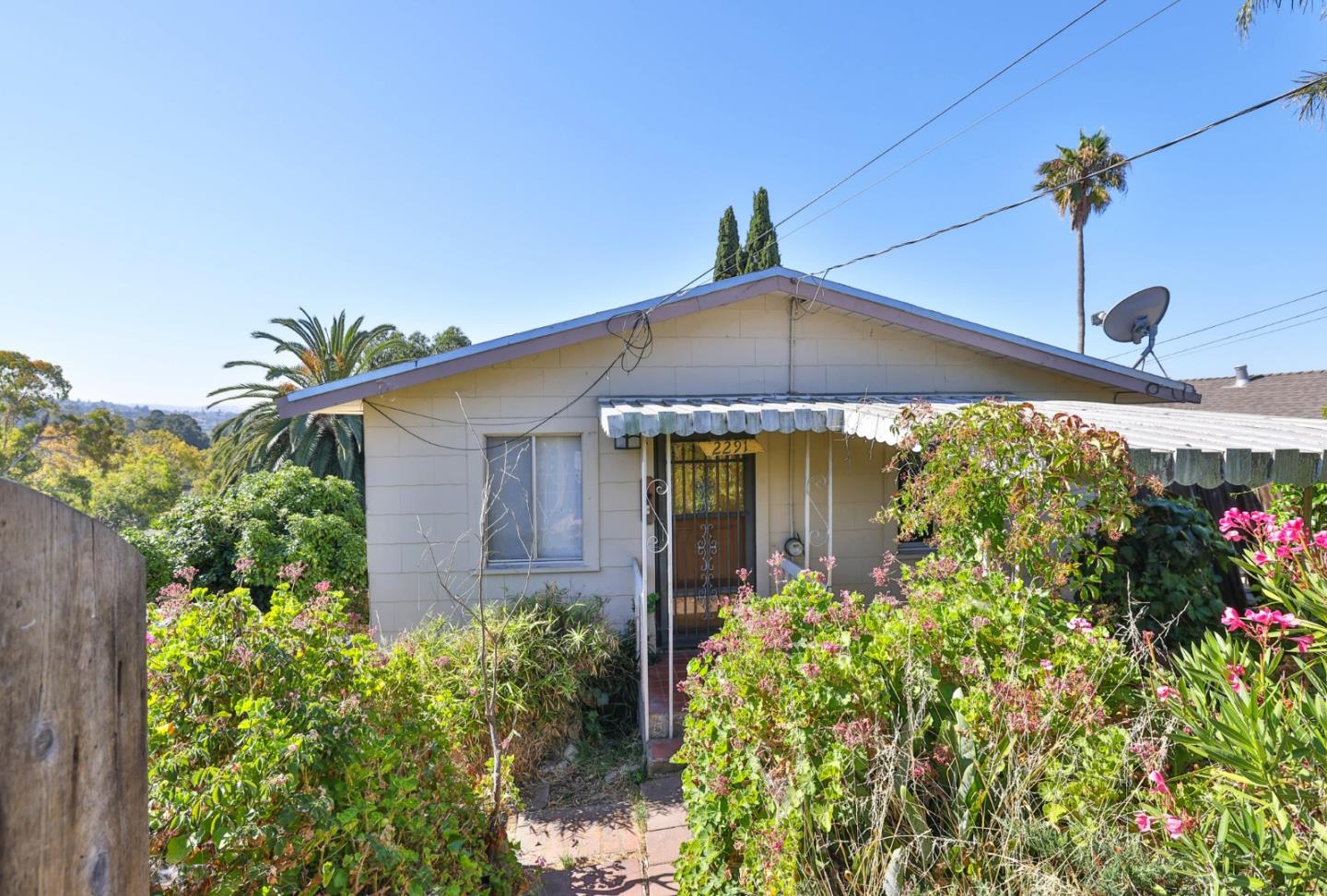 2291 Upland Road San Leandro, CA 94578 - Photo 3 of 32 a front view of a house with a yard