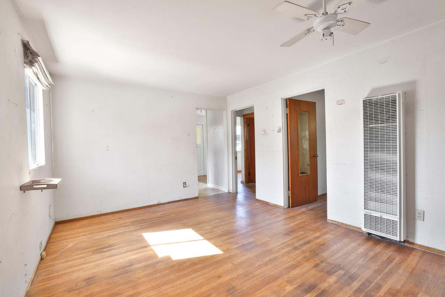 2291 Upland Road San Leandro, CA 94578 - Photo 8 of 32 wooden floor in an empty room with a window