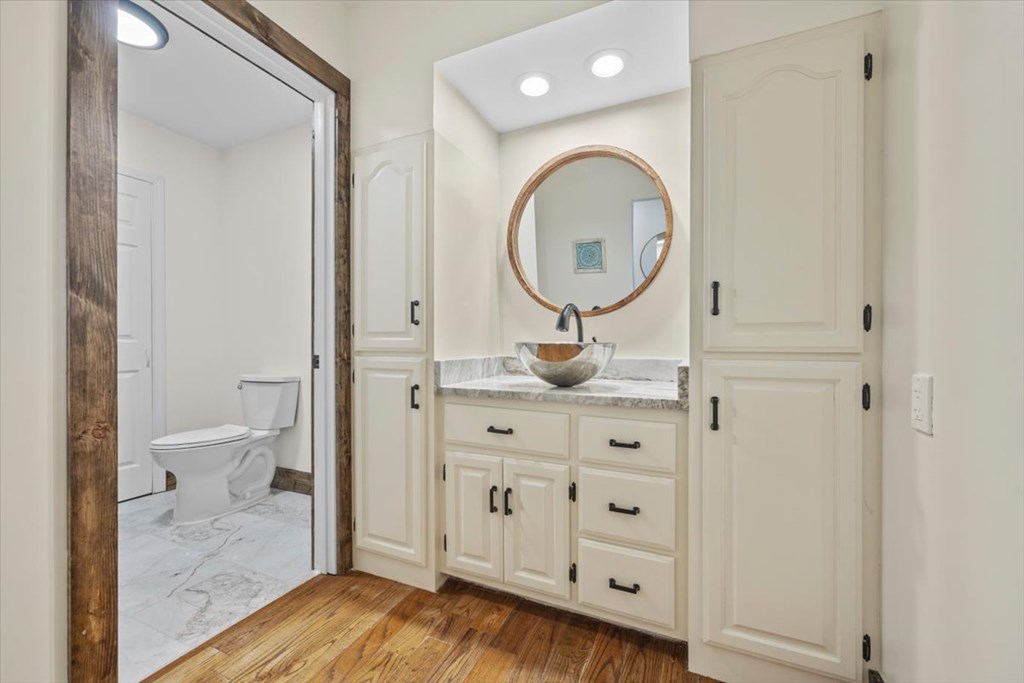 10 Johnson Ford Road Epworth, GA 30541 - Photo 15 of 50 a bathroom with a granite countertop sink mirror vanity and toilet