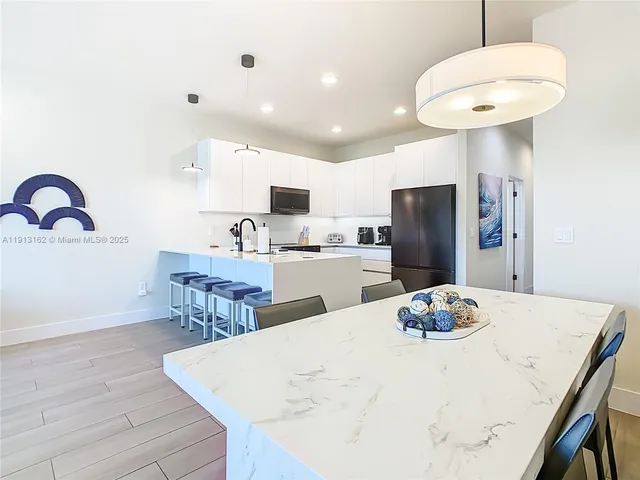 a kitchen that has a sink and a stove in it