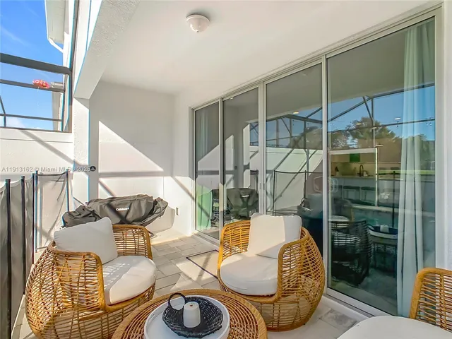 a view of a backyard with sitting area