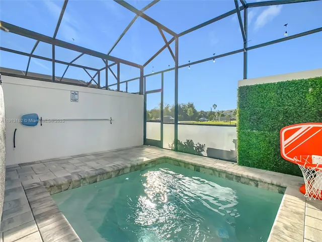 a spacious bedroom with a bed and window