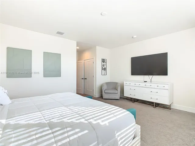 a living room with furniture and gym equipment