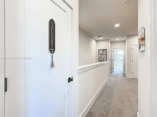 an aerial view of a house with outdoor space swimming pool