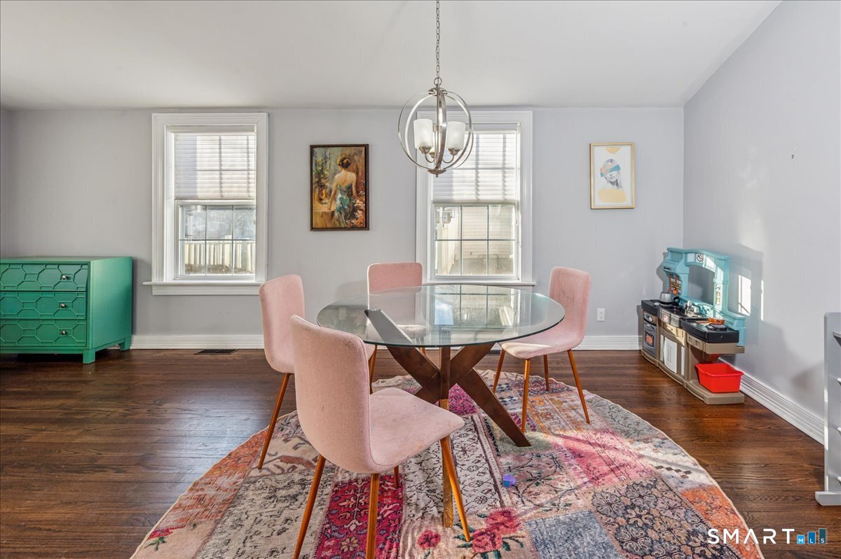 11 Margaret Street Norwalk, CT 06851 - Photo 9 of 26 a workspace with furniture a rug and a window