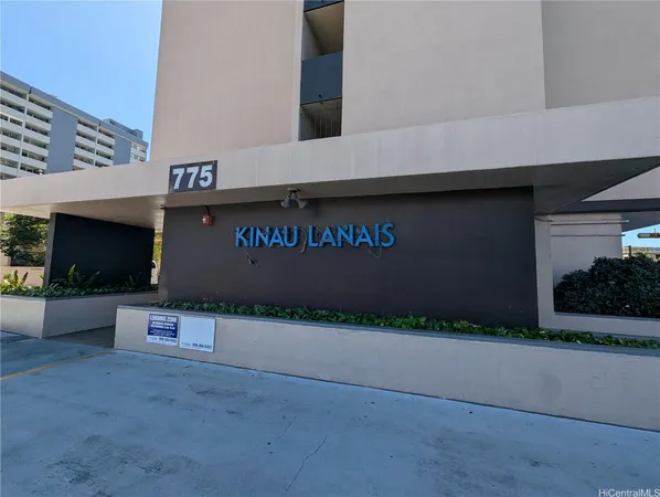 a front view of a building with parking