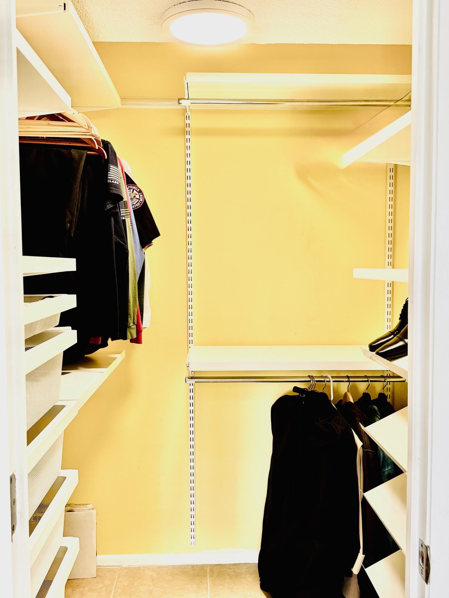 4164 Inverrary Drive, Unit 404 Lauderhill, FL 33319 - Photo 11 of 23 a view of walk in closet with clothes and shoes