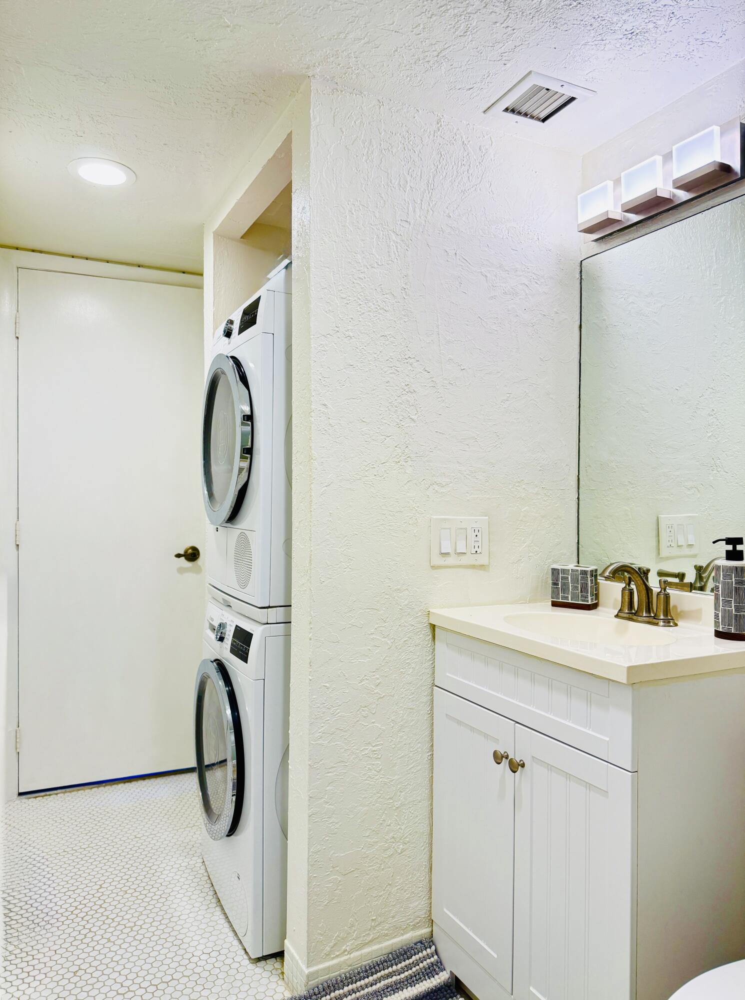 4164 Inverrary Drive, Unit 404 Lauderhill, FL 33319 - Photo 13 of 23 a bathroom with a sink and mirror