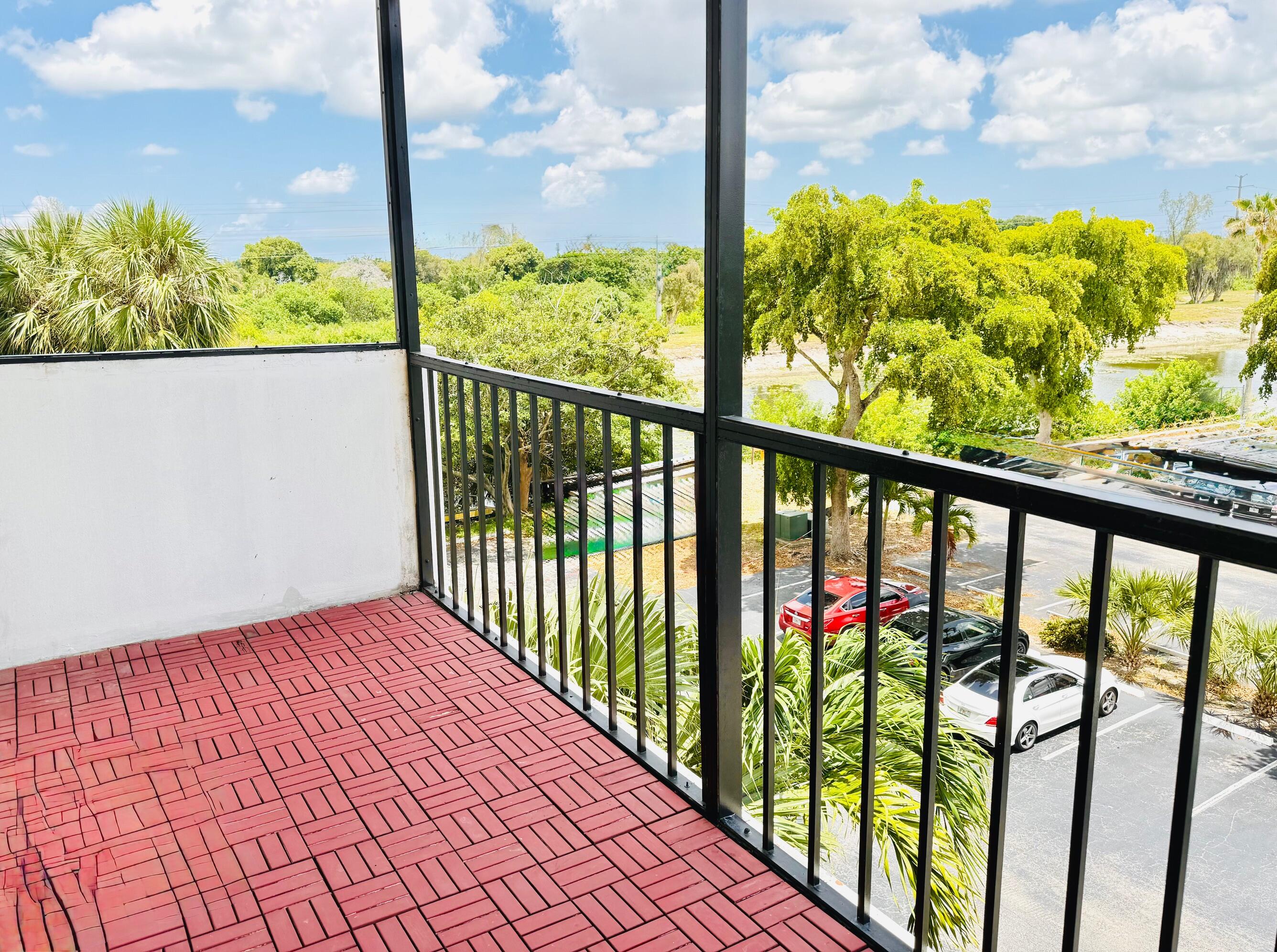 4164 Inverrary Drive, Unit 404 Lauderhill, FL 33319 - Photo 15 of 23 a city view from a balcony