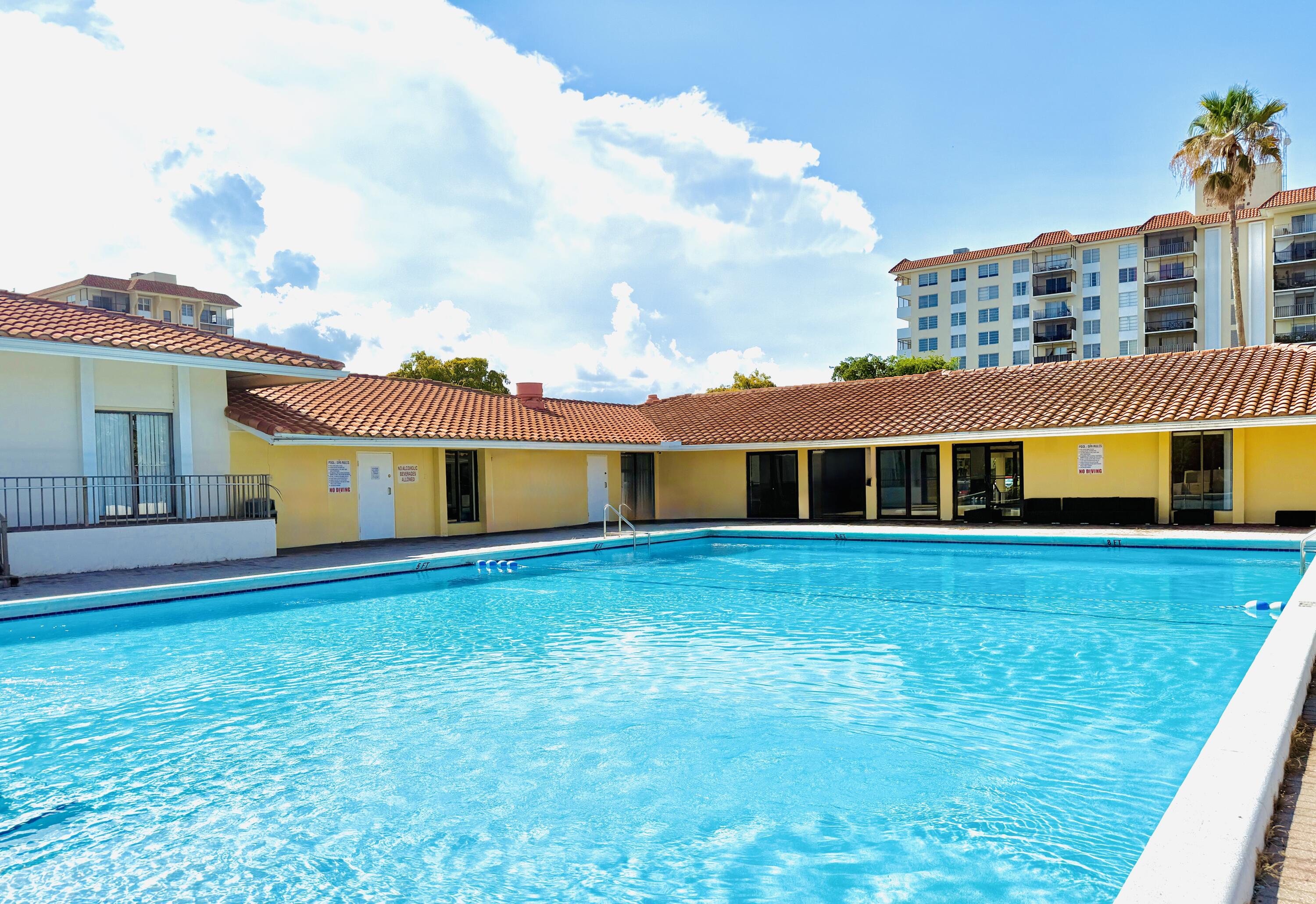 4164 Inverrary Drive, Unit 404 Lauderhill, FL 33319 - Photo 17 of 23 a front view of a house with a yard