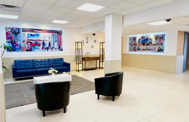 a living room with furniture and a flat screen tv