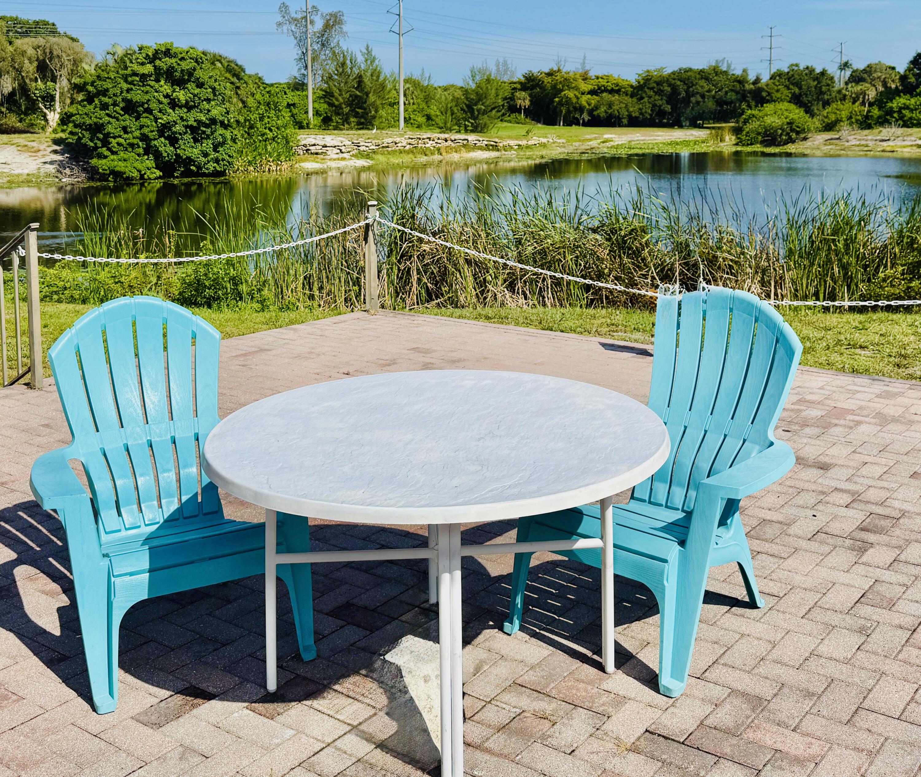 4164 Inverrary Drive, Unit 404 Lauderhill, FL 33319 - Photo 19 of 23 a view of a chairs and table on the deck