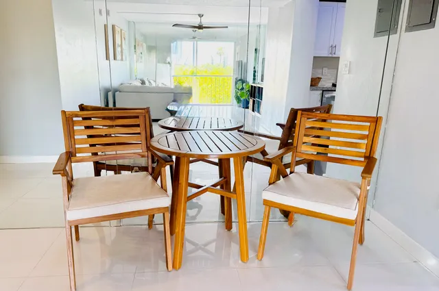 a bedroom with a bed and chandelier