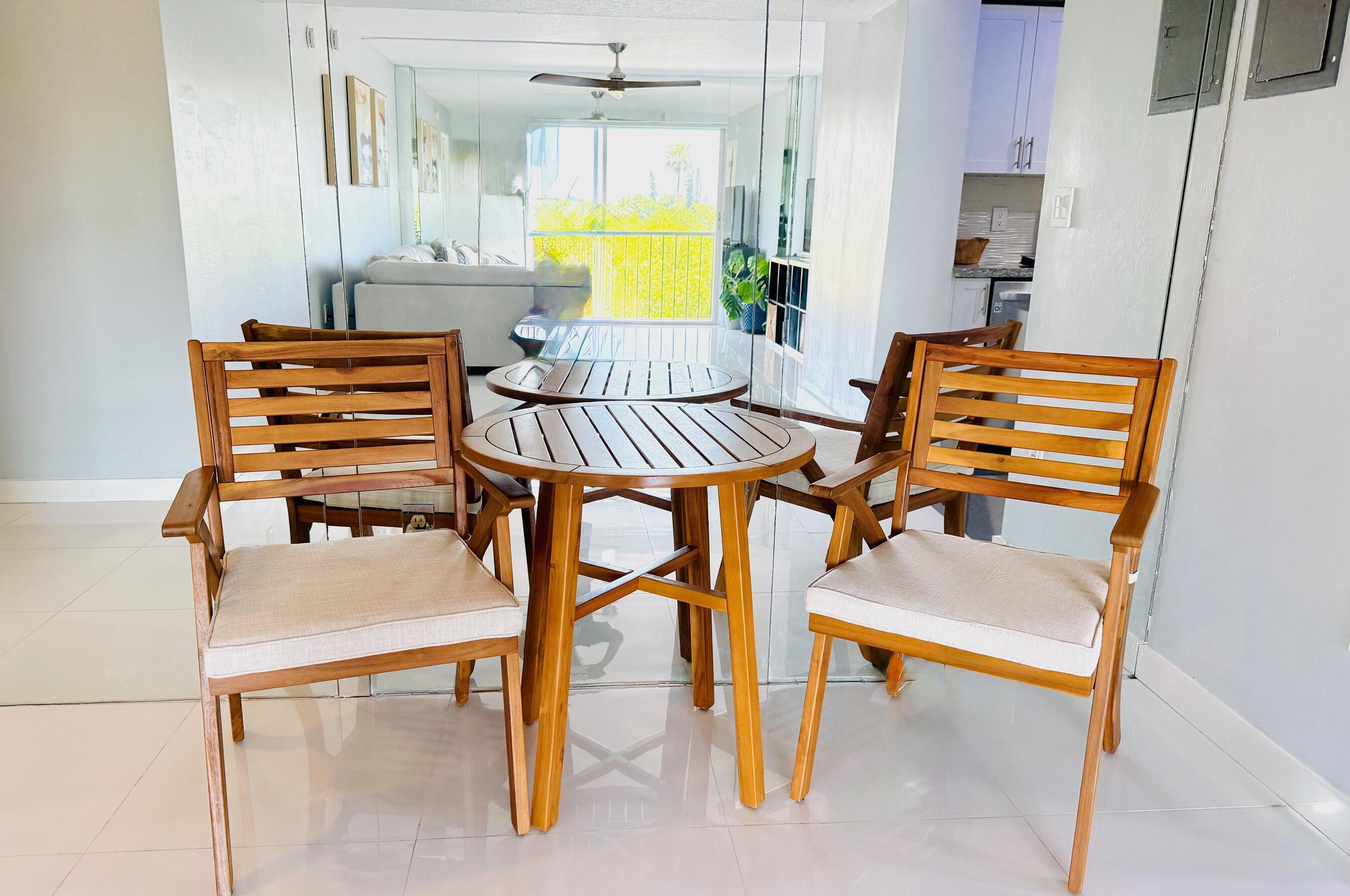 4164 Inverrary Drive, Unit 404 Lauderhill, FL 33319 - Photo 5 of 23 a bedroom with a bed and chandelier