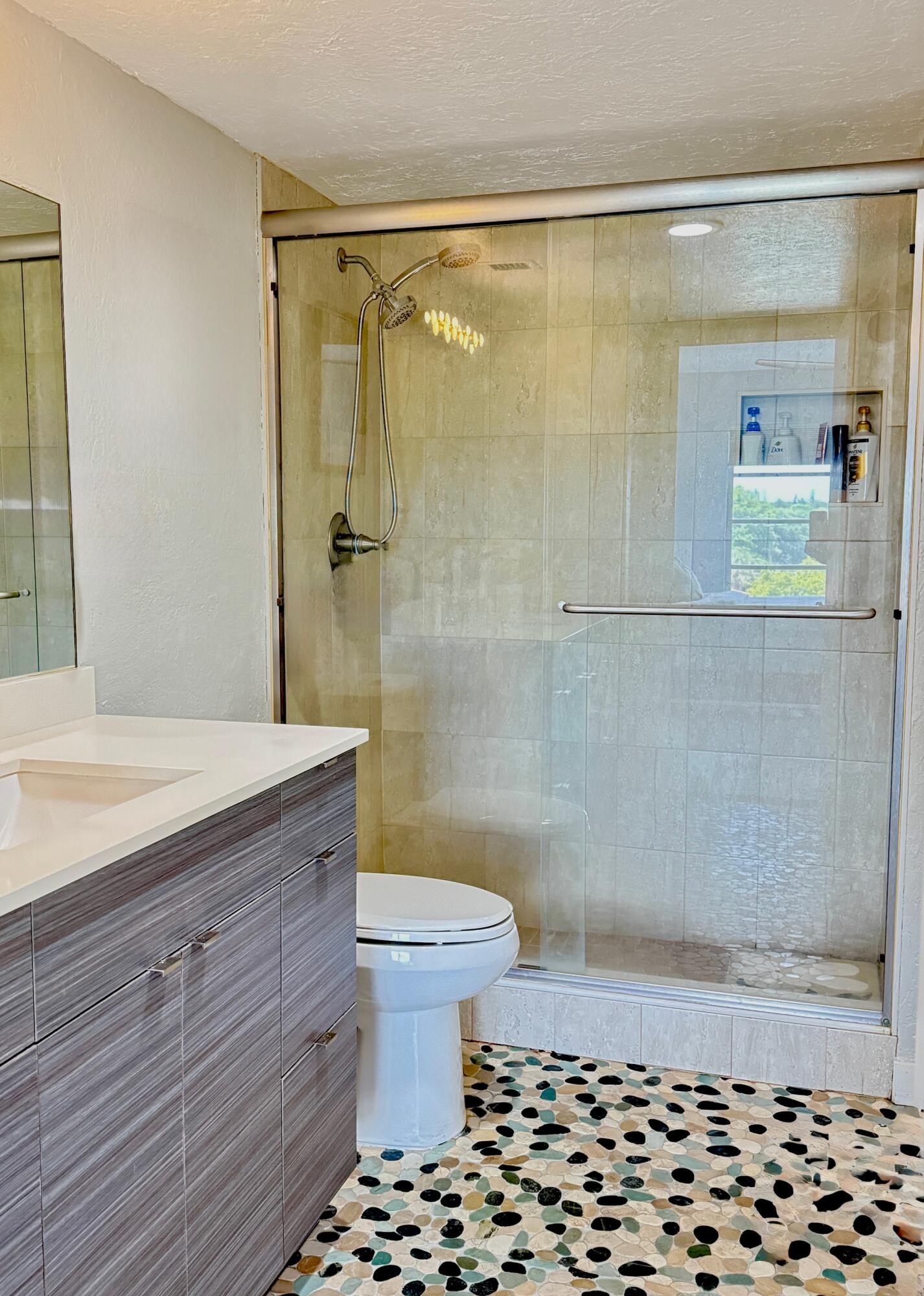 4164 Inverrary Drive, Unit 404 Lauderhill, FL 33319 - Photo 8 of 23 a bathroom with a shower and a toilet