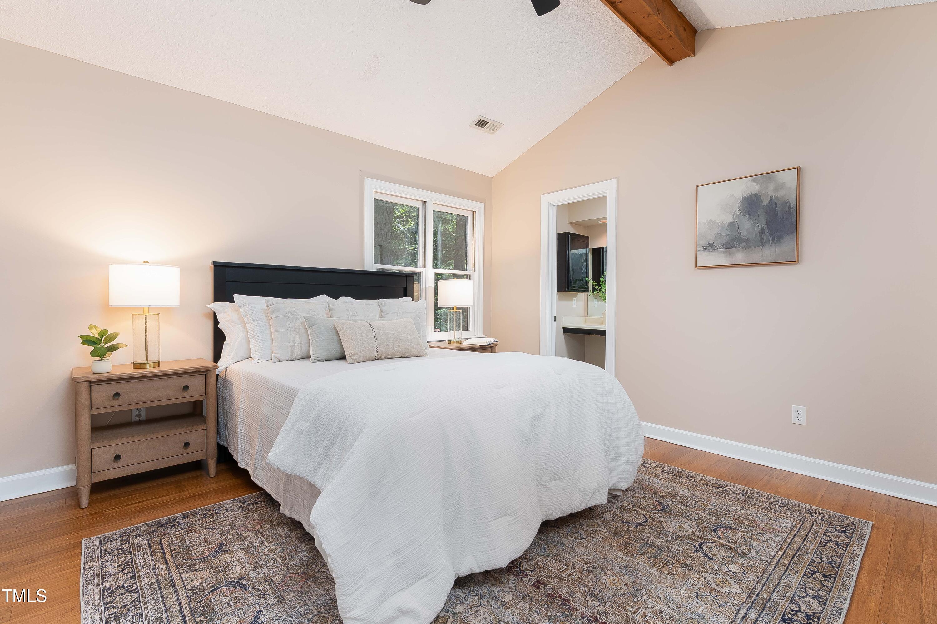 200 West Woodcroft Parkway, Unit 52A Durham, NC 27713 - Photo 12 of 21 a bedroom with a bed and a window