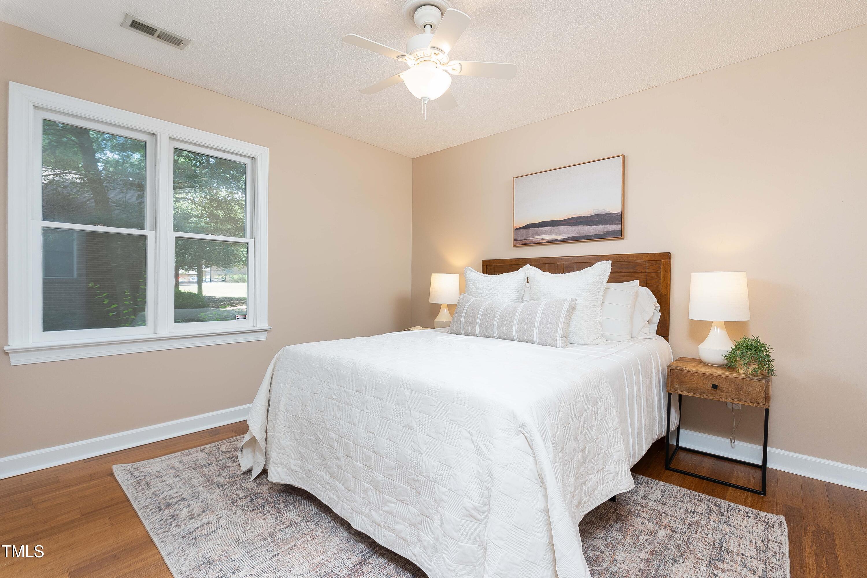 200 West Woodcroft Parkway, Unit 52A Durham, NC 27713 - Photo 15 of 21 a bedroom with a bed and a window