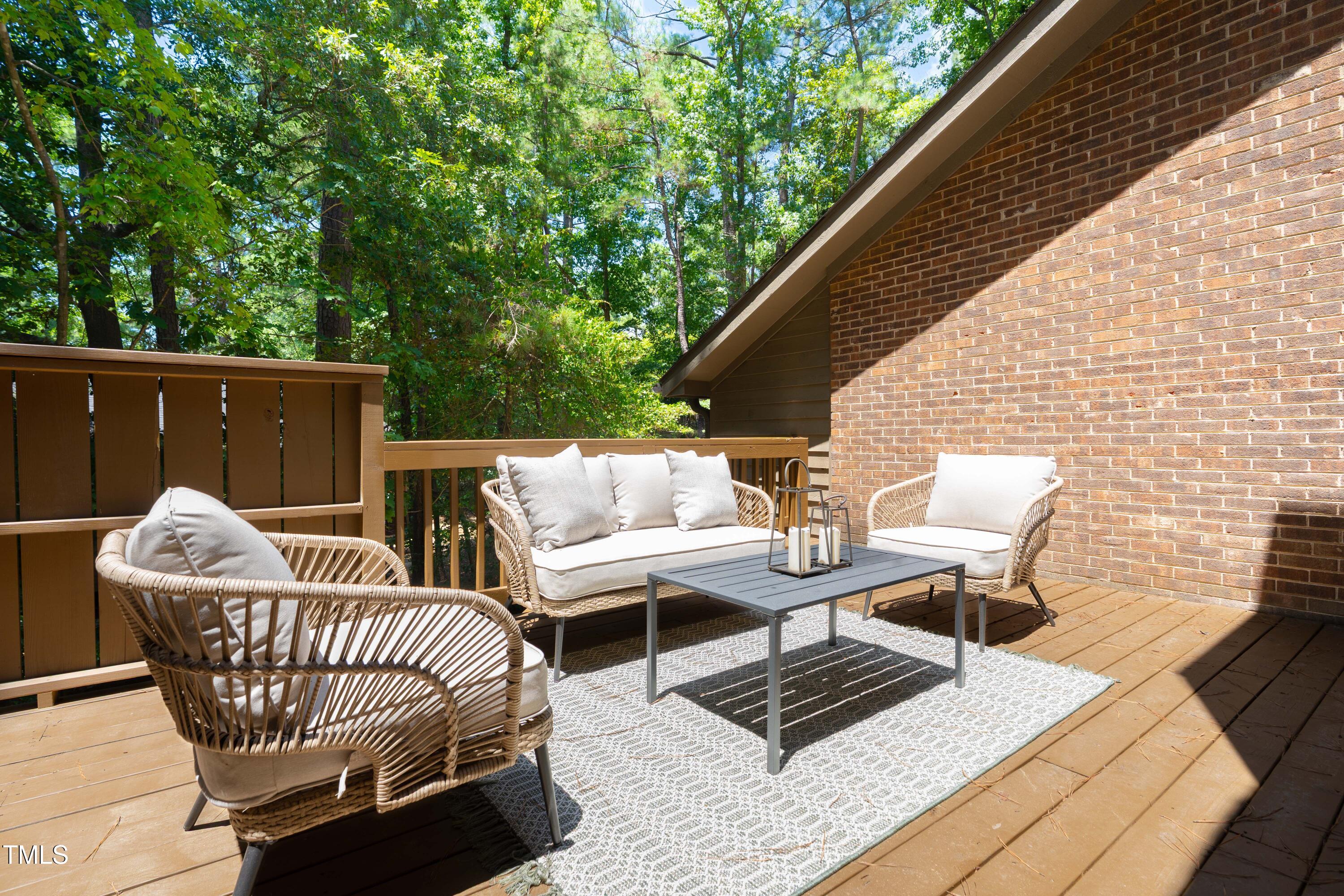200 West Woodcroft Parkway, Unit 52A Durham, NC 27713 - Photo 17 of 21 a roof deck with a table and chairs