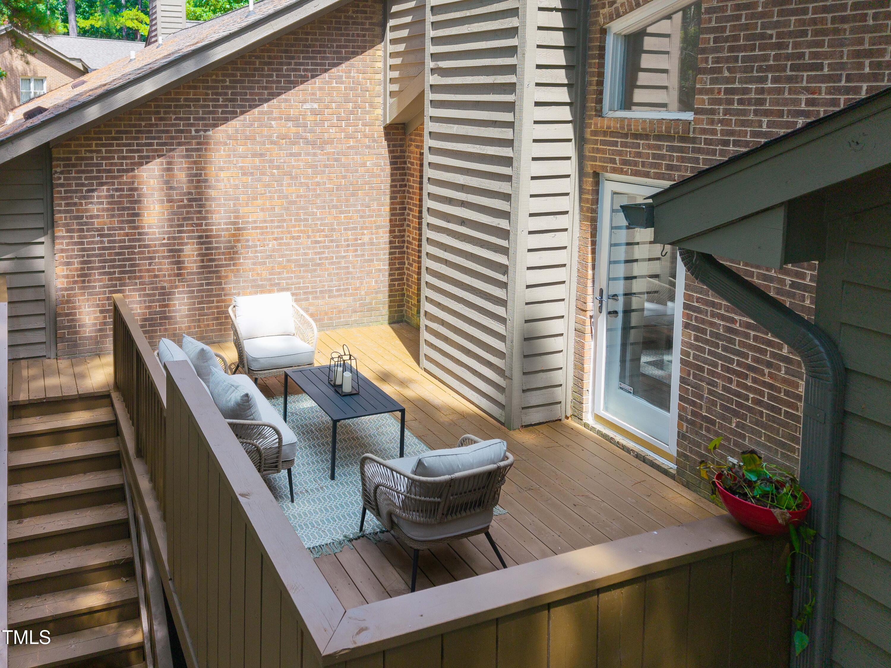 200 West Woodcroft Parkway, Unit 52A Durham, NC 27713 - Photo 18 of 21 a view of a balcony with chairs