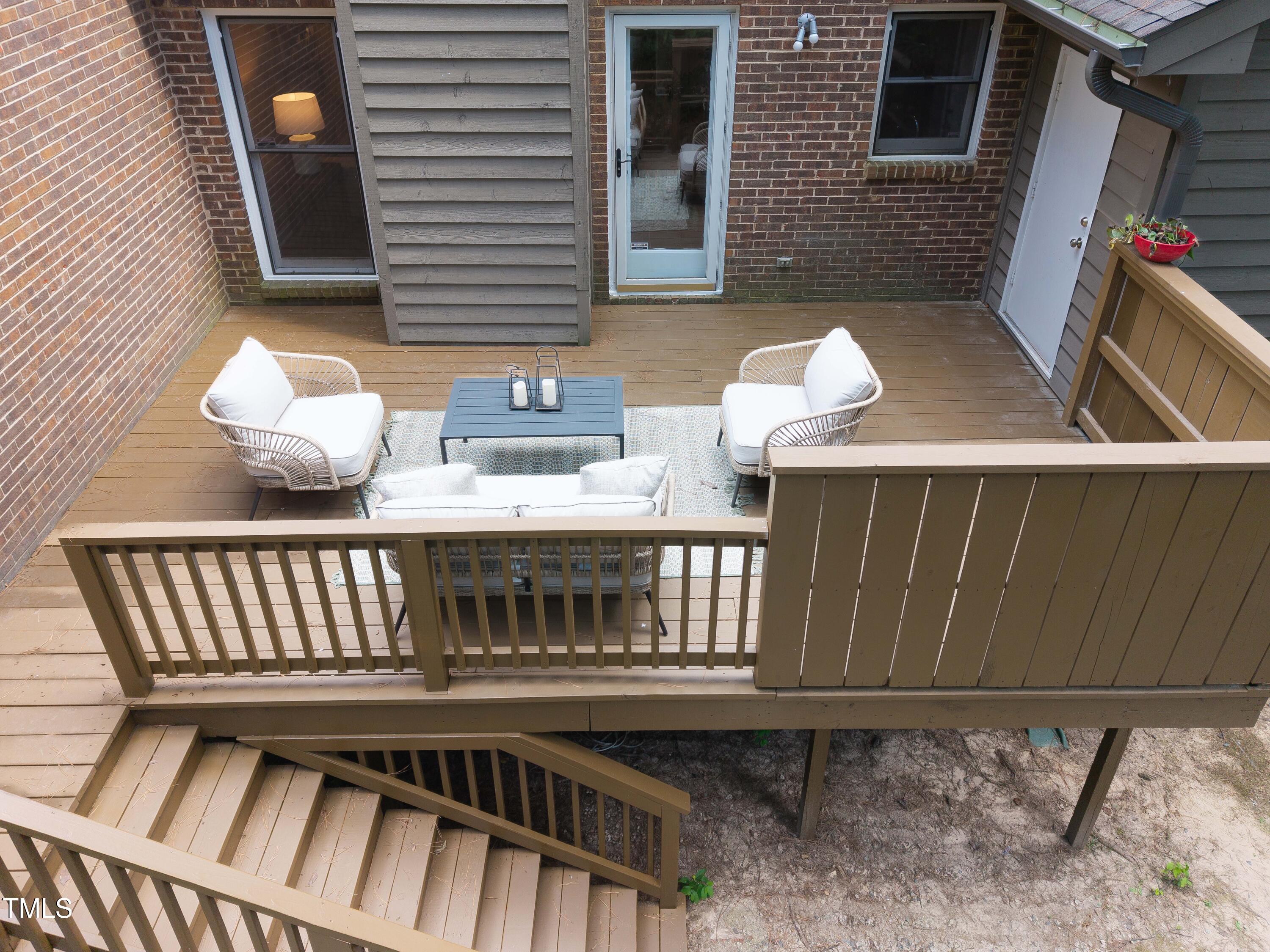 200 West Woodcroft Parkway, Unit 52A Durham, NC 27713 - Photo 20 of 21 a view of a chairs and table in the balcony