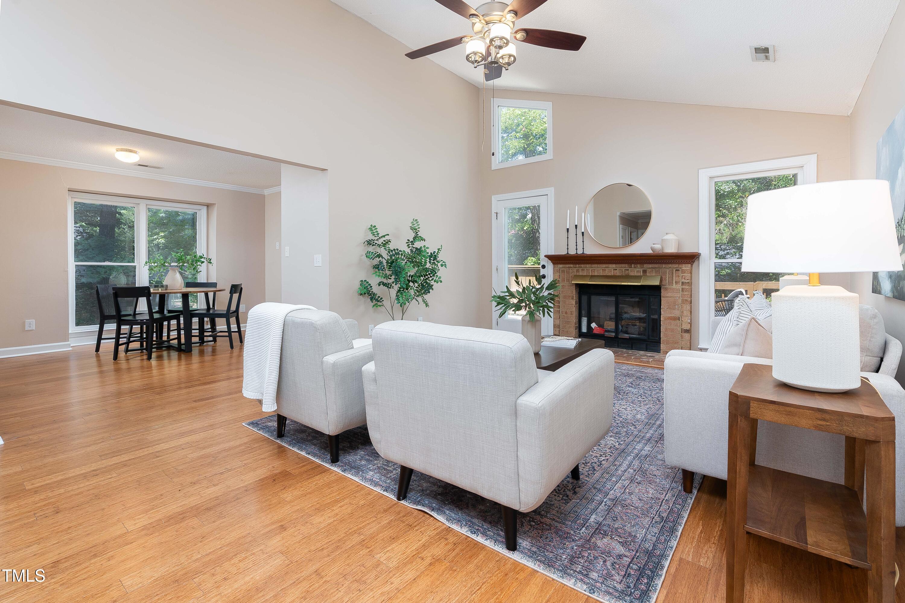 200 West Woodcroft Parkway, Unit 52A Durham, NC 27713 - Photo 2 of 21 a living room with furniture and a fireplace